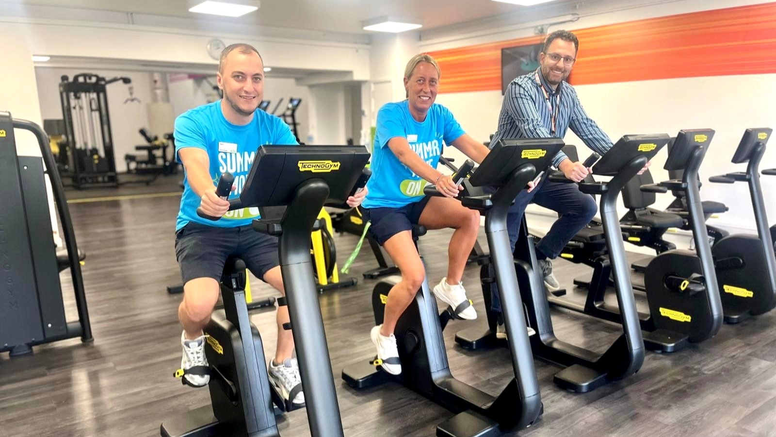 Cllr Jacopo Lanzoni (right) trying out new equipment at South Reading Leisure Centre with general manager Alex and fitness instructor Lisa. Credit Reading Borough Council